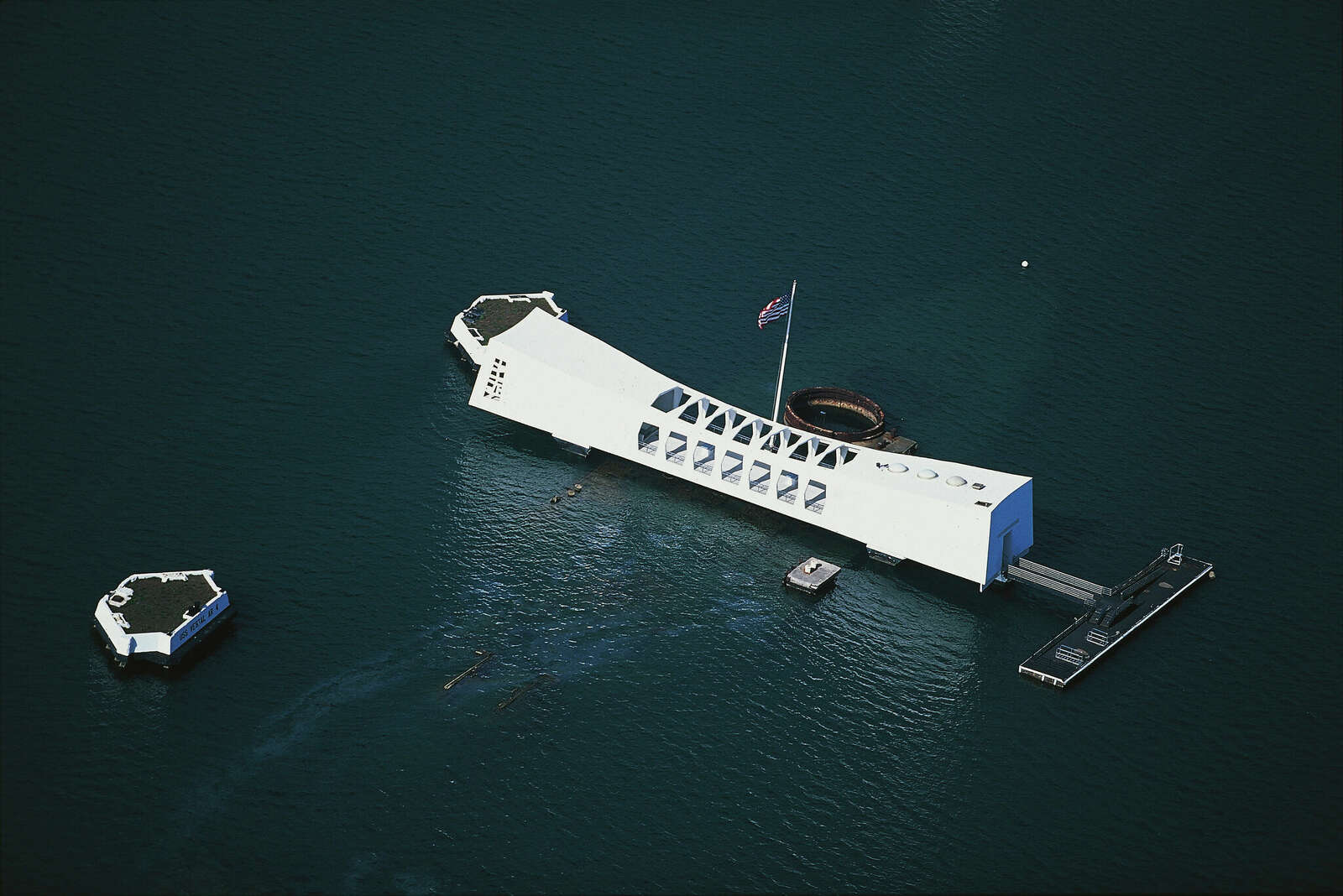 Aerial view of the USS Arizona Memorial, monument in memory of the USS Arizona battleship which was sunk during the Japanese attack on December 7, 1941, World War II, Oahu island, Hawaii, USA.

