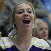 A Routt cheerleader cheers as the Rockets take the floor against Triopia Tuesday night.