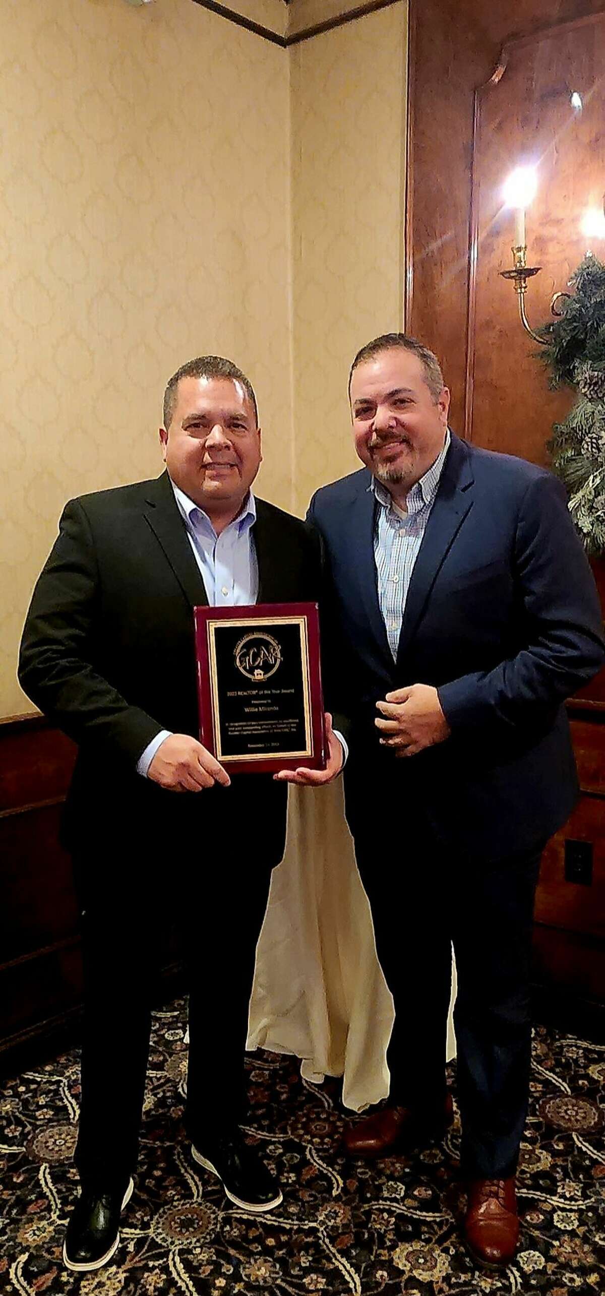 Willie Miranda, left, with Brian Miranda, both of Miranda Real Estate Group. Willie Miranda was given the 2022 Realtor of the Year award from the Greater Capital Association of Realtors.
