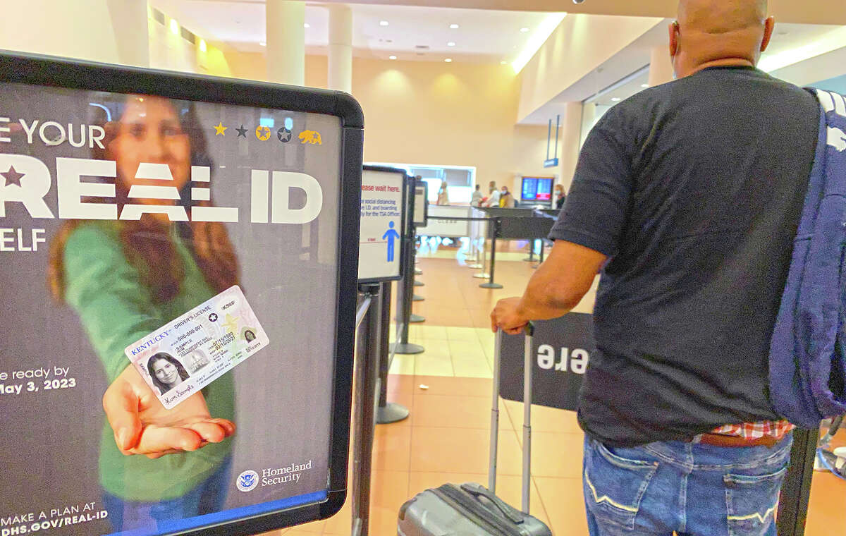 A Homeland Security sign for Real IDs greets travelers at an airport. The deadline for getting one of the enhanced IDs was months away, but has been extended to 2025.