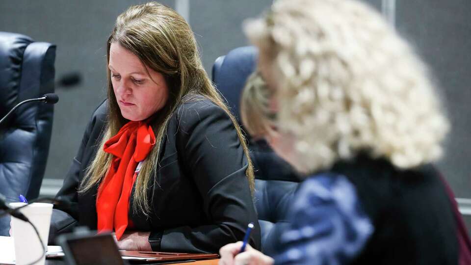 Conroe ISD board member Melissa Dungan, center, is seen during a special Conroe ISD board meeting at the Deane L. Sadler Administration Building, Tuesday, Dec. 6, 2022, in Conroe. Dungan, along with Misty Odenweller and Tiffany Nelson, ran as a conservative slate known as 