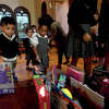 Students at St. Anthony Cathedral Basilica School bring their toys to the altar for a blessing during the annual "Blessing of the Toys" mass Wednesday. All the toys collected were donated to the Enterprise Empty Stocking Fund and will be given out to children in need at next week's distribution. Photo made Wednesday, November 30, 2022 Kim Brent/Beaumont Enterprise