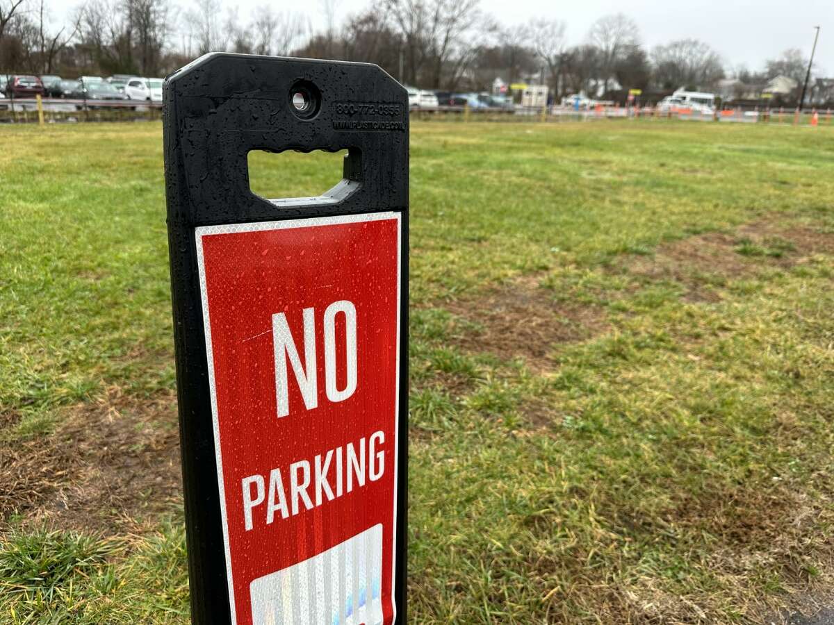 Tweed New Haven Regional Airport operator Avports LLC has put a "No Parking" sign in an area near the airport's remote parking lot where vehicles were found parked on the grass in an unauthorized area.