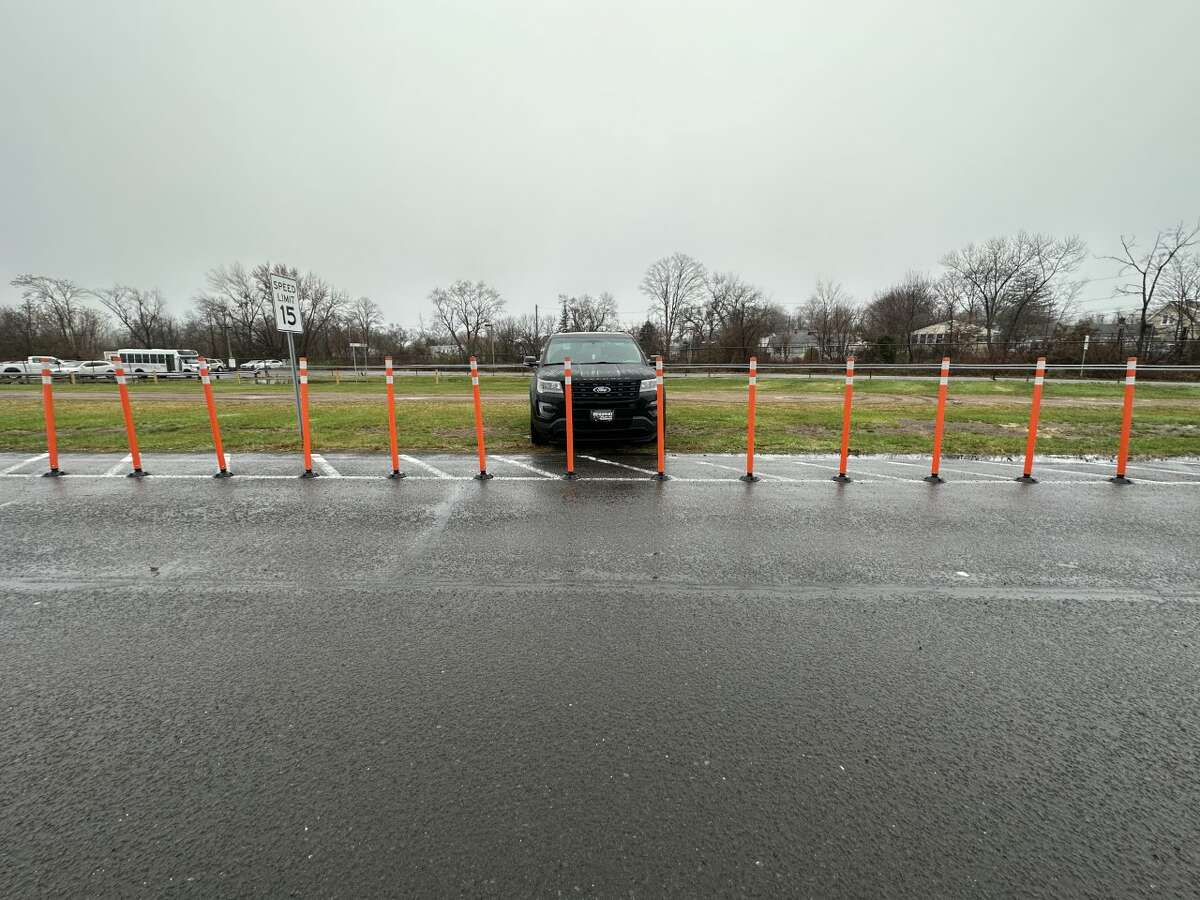 Tweed New Haven Regional Airport operator Avports LLC has put orange cones as a parking deterrent in an area near the airport's remote parking lot where vehicles were found parked on the grass in an unauthorized area.