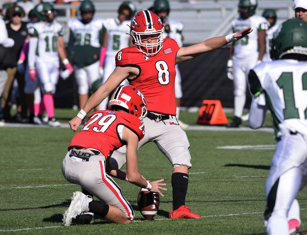 New Canaan's Ty Groff (8) kicks an extra point during a football game against Norwalk at Dunning Field on Saturday, Oct. 15, 2022.