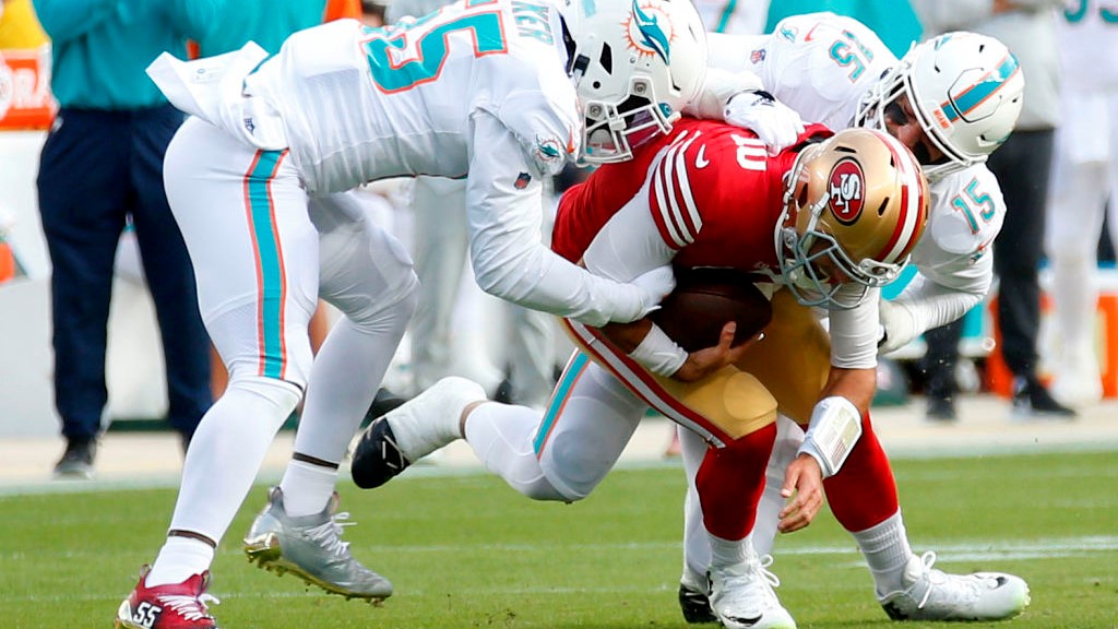 49ers beat Dolphins, but lose Garoppolo for the season with a