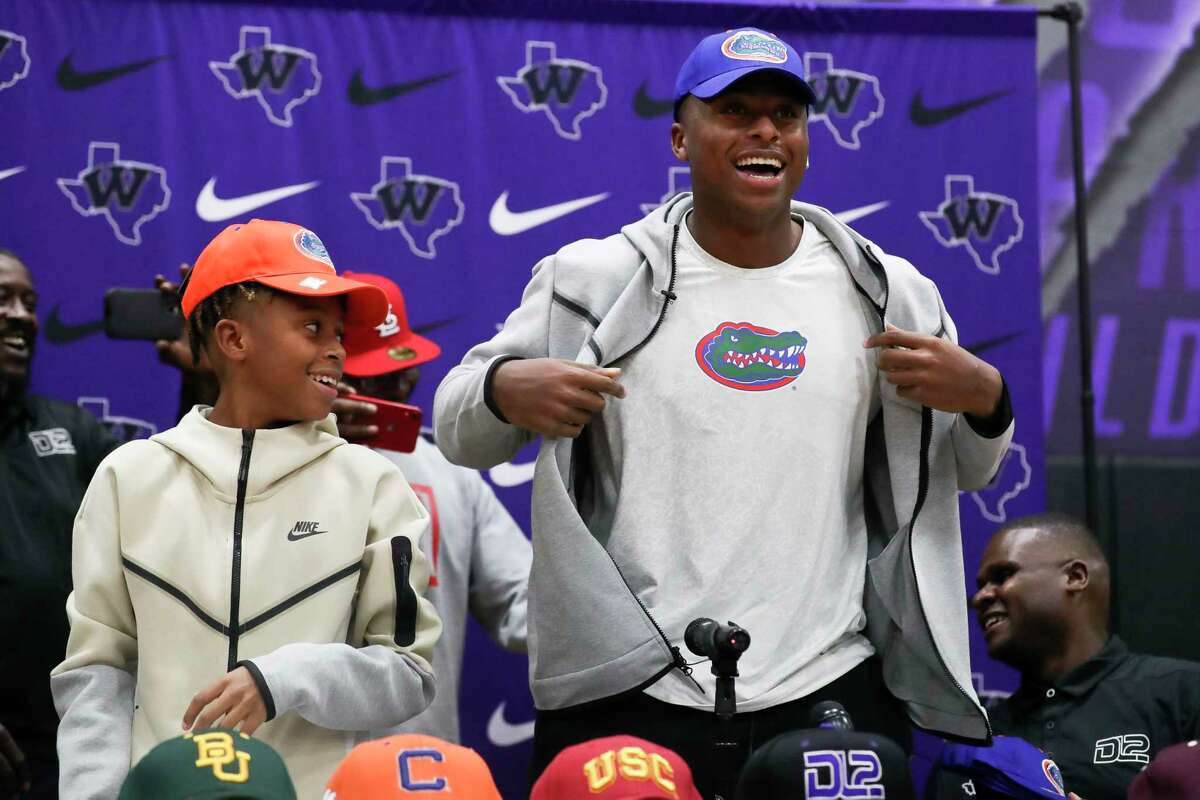 Willis junior quarterback DJ Lagway shows off a Florida t-shirt after announcing plans to sign with the Gators at Willis High School, Wednesday, Dec. 7, 2022, in Willis. Lagway, whose choose the Gators over Baylor, Texas A&M, USC and Clemson, is ranked as the No. 12 recruit in the Class of 2024, according to ESPN.