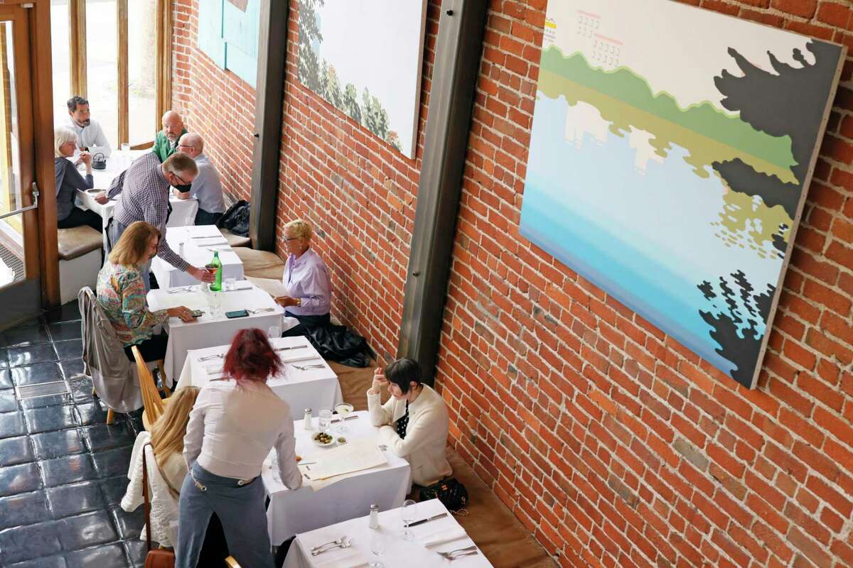 Zuni Cafe in San Francisco, shown in July, announced a temporary closure from Nov. 30 to Dec. 7 due to an “upsurge” of COVID cases among staff members. How COVID, flu and RSV tripledemic impacts Bay Area indoor dining.