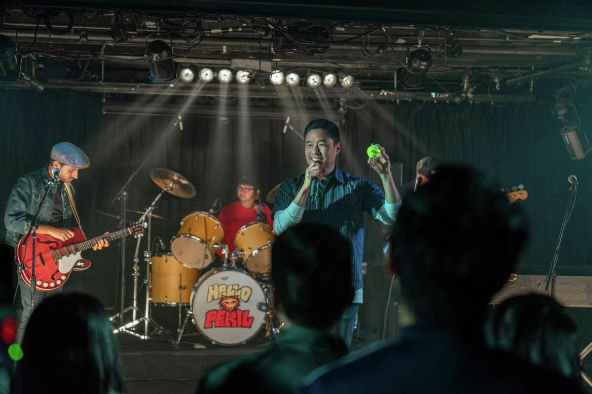 Randall Park performs with the band Hello Peril in the movie "Always Be My Maybe."