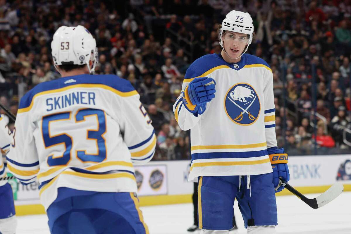 Buffalo Sabres' Tage Thompson, right, celebrates his goal against the Columbus Blue Jackets with Jeff Skinner during the first period of an NHL hockey game Wednesday, Dec. 7, 2022, in Columbus, Ohio.
