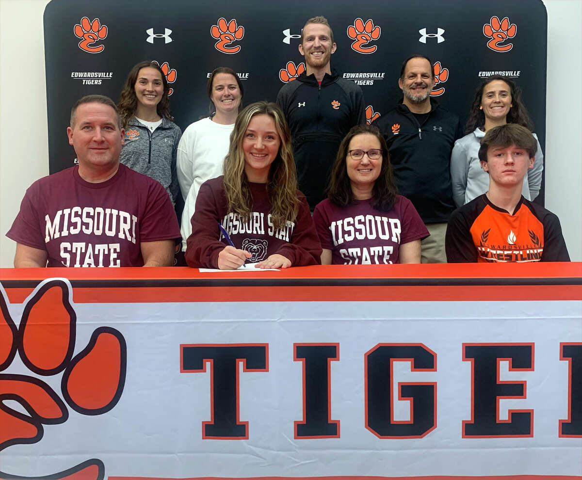 Edwardsville senior Emily Nuttall, seated second to left, recently signed a Letter of Intent to compete in cross country and track and field at Missouri State University in Springfield.