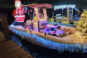 Santa trades his sleigh for boat at Lake Houston Christmas parade