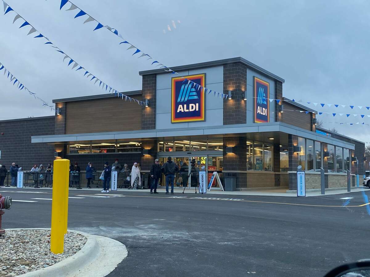 The new Aldi location held its grand opening Thursday, as customers waited outside to enter the store. 