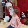 Alden Sery, of Midland, visits with Santa Tuesday when the Sanford Santa House debuted. He asked Santa for Legos.