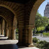 A cyclist rides through the campus of Stanford University in Stanford, Calif. Tuesday, June 28, 2022.