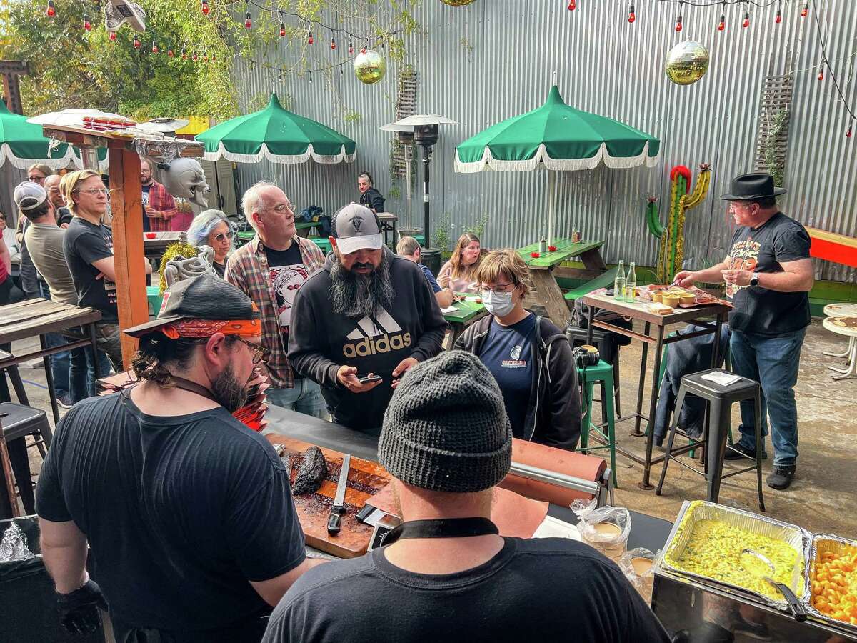 Customers line up at Willow's Texas BBQ pop-up at Two Headed Dog bar