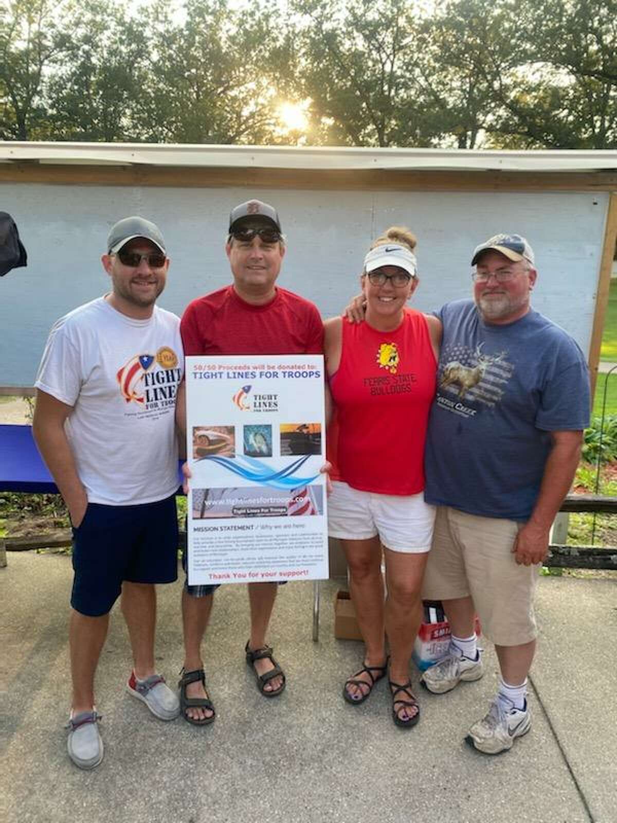 Osceola County business owners (left to right) Eric Rasmussen, Brian Rasmussen, Sheri Edstrom, and Jamie Edstrom pose for a photo during a golf tournament hosted by Ashton General Store and Sunny’s Bar and Grill in September.