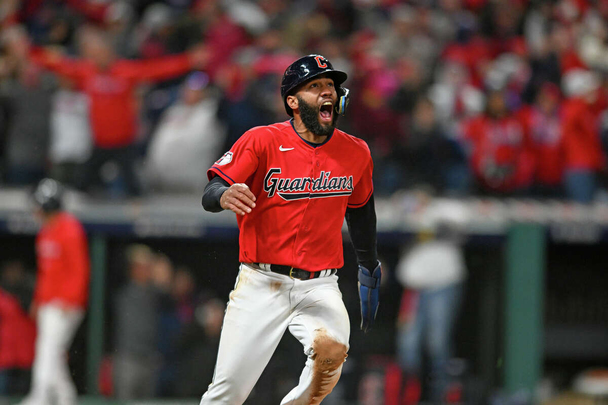Amed Rosario #1 of the Cleveland Guardians celebrates scoring the winning run on a walk-off two-run single by Oscar Gonzalez to defeat the New York Yankees 6-5 in Game 3 of the American League Division Series at Progressive Field on October 15, 2022 in Cleveland, Ohio.