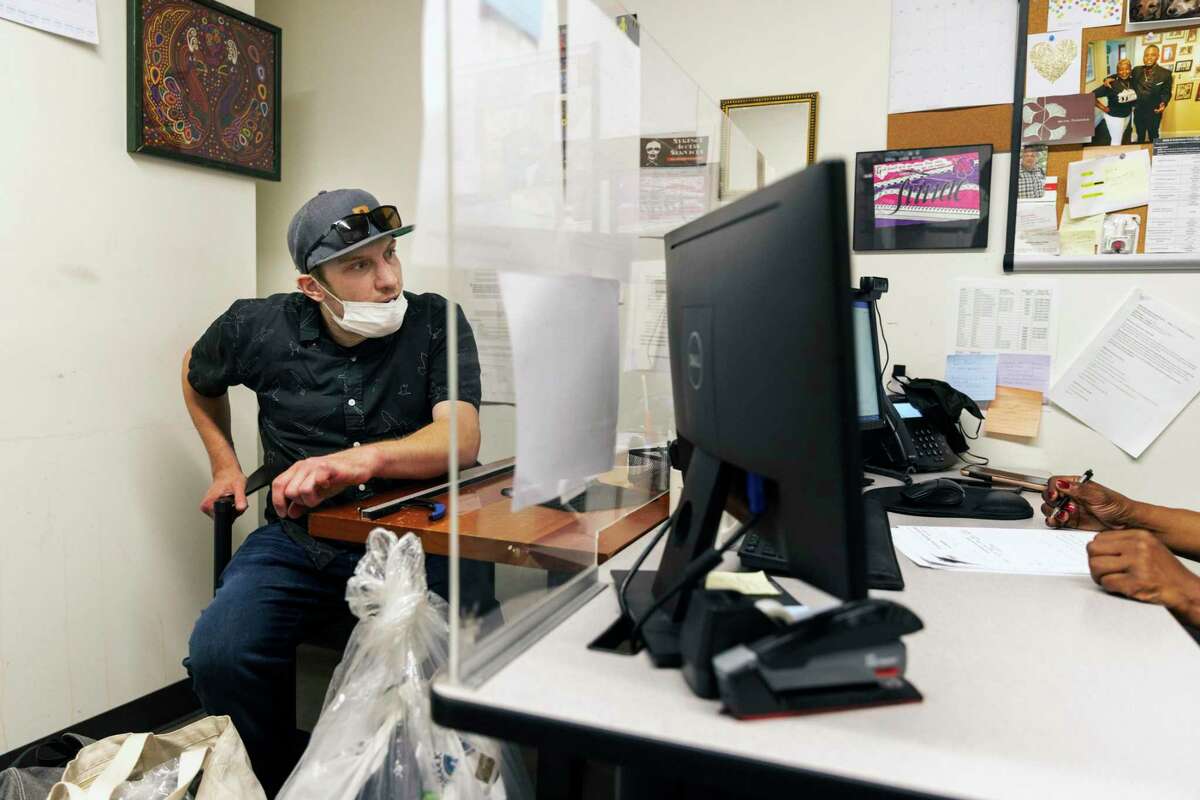 Ben Campofreda arrives at HealthRIGHT 360 in San Francisco, Calif., Thursday, Sept. 22, 2022. Campofreda began his 90 day-residential treatment in his attempt to stop his fentanyl addiction. He sits in an office to process his paperwork before going to the treatment center.