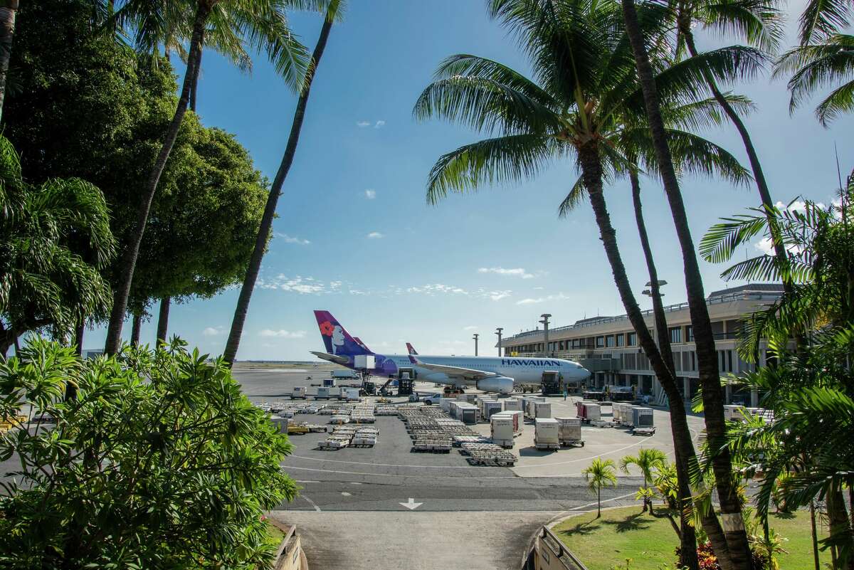 Hawaiian Airlines airplane being fueled and loaded at the Daniel K. Inouye International Airport.
