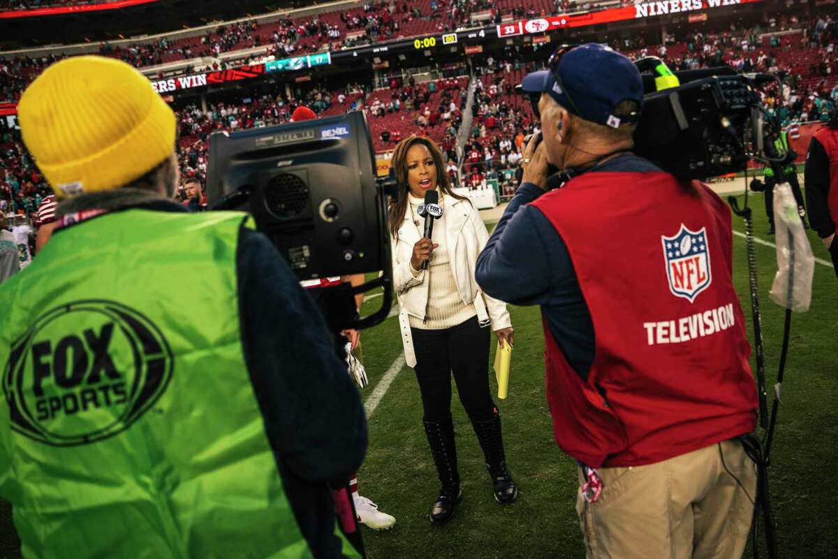 Pam Oliver, a longtime sideline reporter for Fox Sports, conducts a post-game interview after the 49ers beat the Dolphins at Levi’s Stadium last Sunday. She has worked over 500 NFL games.
