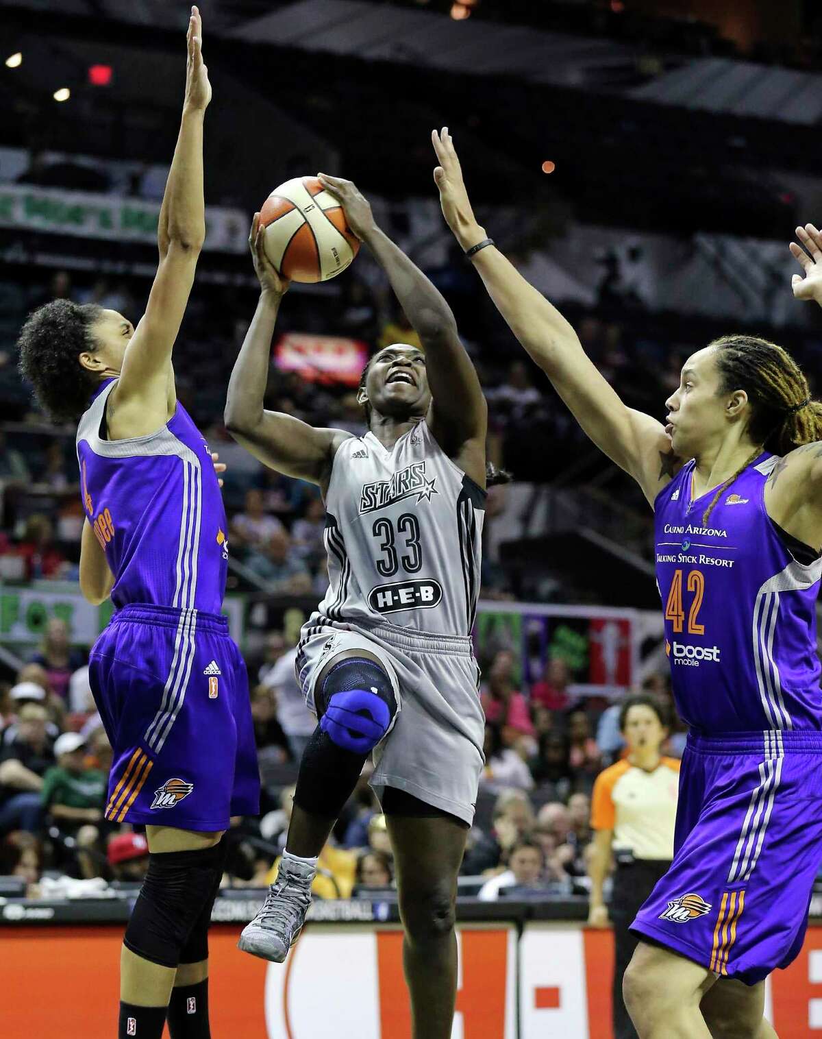 San Antonio Stars' Sophia Young-Malcolm shoots between Phoenix Mercury's Candice Dupree (left) and Brittney Griner during their WNBA game Saturday June 7, 2014 at the AT&T Center. The Mercury won in double overtime 91-79.
