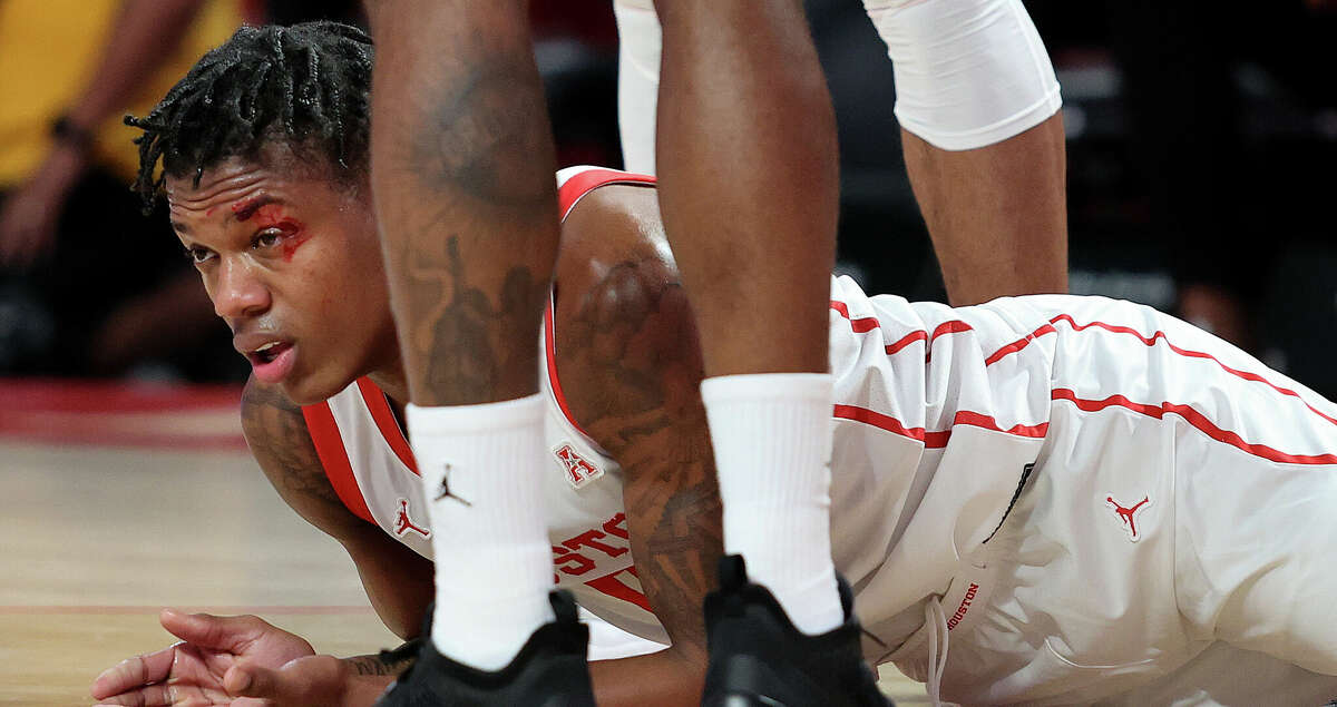 Marcus Sasser #0 of the Houston Cougars sustains a cut to his left eye during the first half against the North Florida Ospreys at Fertitta Center on December 06, 2022 in Houston, Texas. (Photo by Bob Levey/Getty Images)