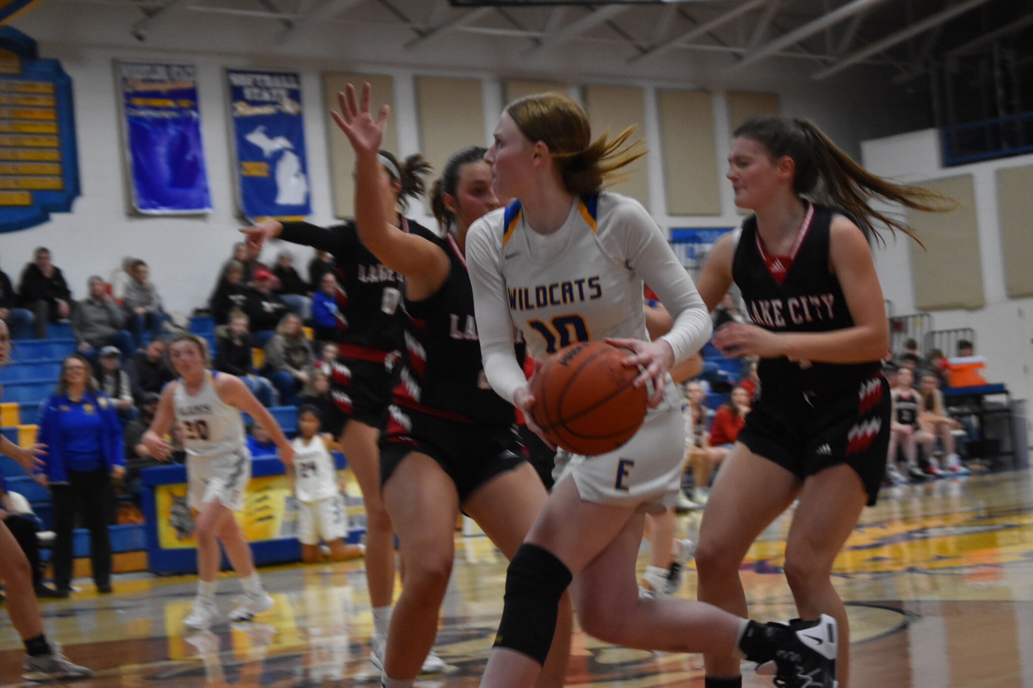 Evart girls basketball stuns Lake City with last second shot