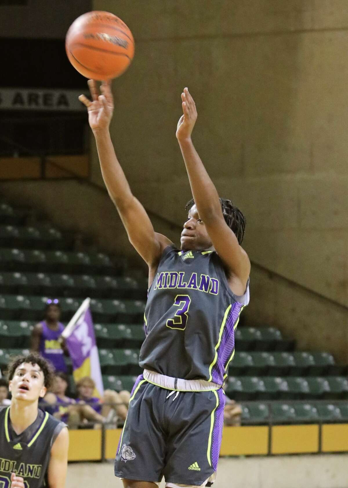 Midland High's Tyquon Satterwhite shoots the ball against Birdville during the Tall City Oilman's Classic on 12/8/2022. 