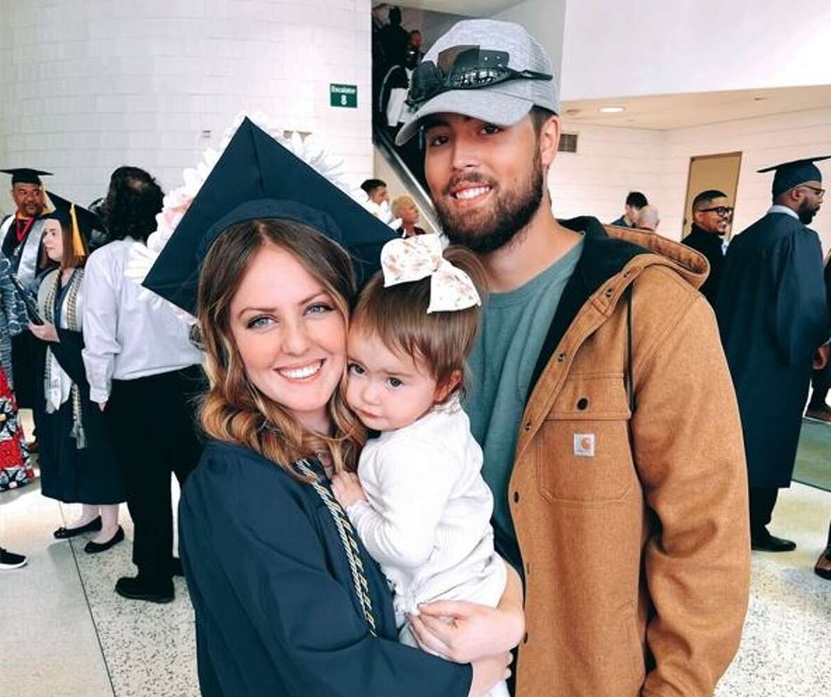 Brenna Alicea-Maas, of Granite City, reccently graduated from Western Governors University. With her are her husband, Dylan Alicea, and their daughter, Joy.