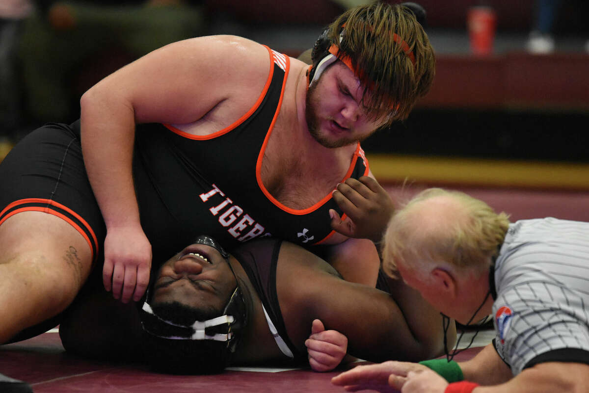 Edwardsville's Dawson Rull with a pin in a match against Belleville West on Thursday in Belleville.