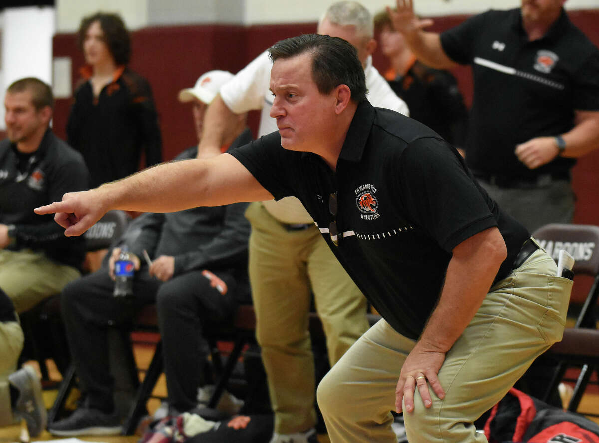 Edwardsville coach Jon Wagner gives instructions in a match against Belleville West earlier this season in Belleville.