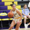 CM's Meredith Brueckner, shown driving to the basket against Jersey in a game earlier this season in Bethalto, scored nine points Thursday night in the Eagles' home win over Triad.