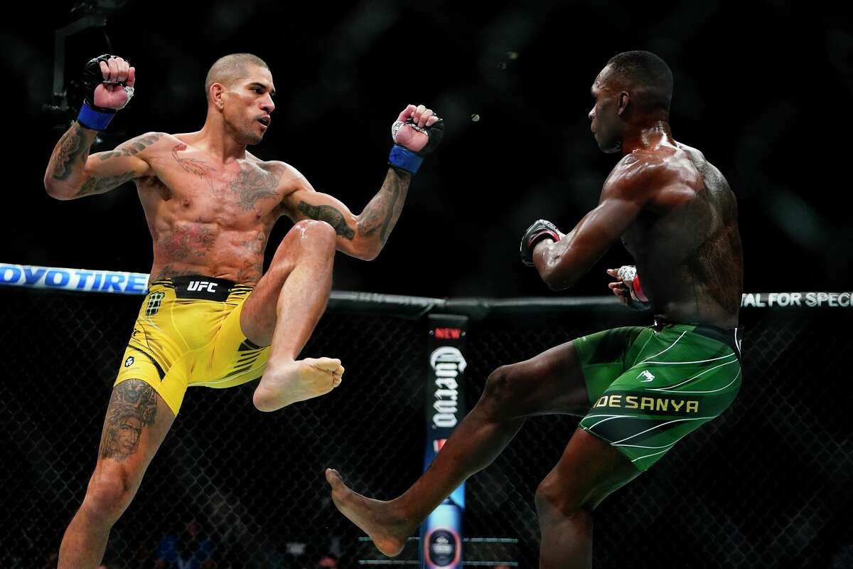 Alex Pereira, left, fights Israel Adesanya during UFC 281 on Sunday, Nov. 13. UFC Fight Night returns to San Antonio in March for the first time since 2019. 