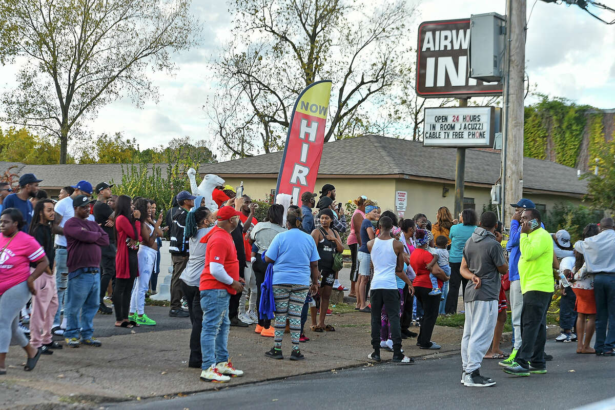 Crowds gather outside of Makeda's Cookies bakery after Young Dolph was shot and killed on November 17, 2021 in Memphis, Tennessee. 