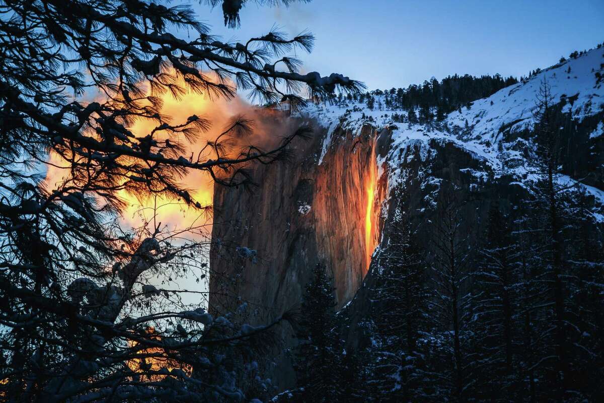 Yosemite’s Firefall flows over at El Capitan.