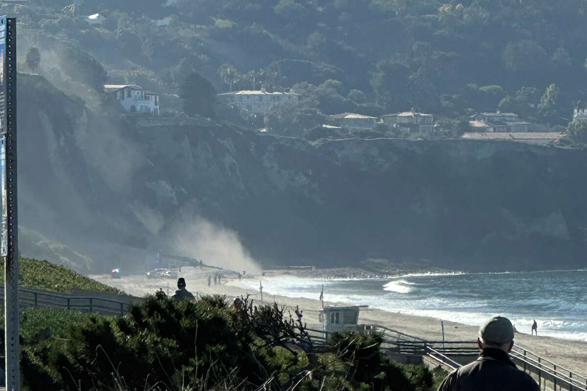 A TV news helicopter overhead captured the moment a Southern California cliffside collapsed Friday morning, Nov. 9, 2022, in Palos Verdes Estates, Calif.