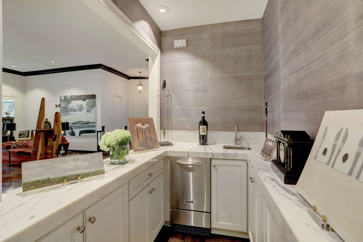 The wet bar has custom cabinetry. 