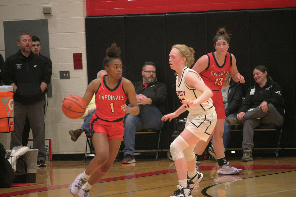 Big Rapids' Leila Valentine (left) tries to work the ball past Reed City's Morgan Hammond during Friday's game.
