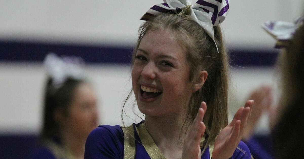 A Routt cheerleader cheers during Friday's boys' basketball game against South County at the Routt Dome in Jacksonville.