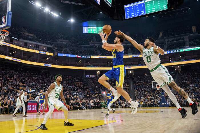 FILE - Golden State Warriors forward Jonathan Kuminga stands on the court  during the second half of an NBA basketball game against the Los Angeles  Clippers Monday, Feb. 14, 2022, in Los