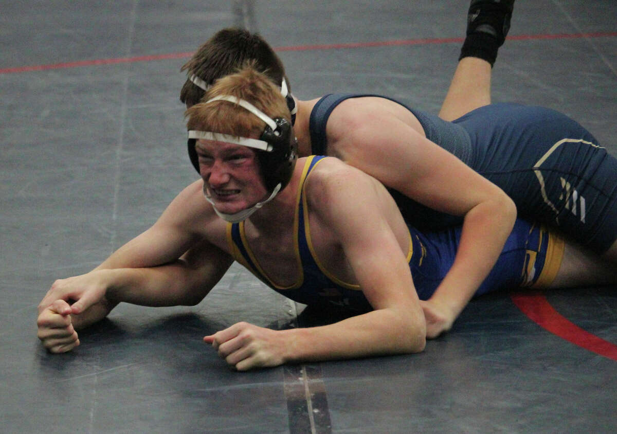 Evart's Cole Staat tries to break free from his Lakeview opponent at Saturday's Big Rapids Invitational