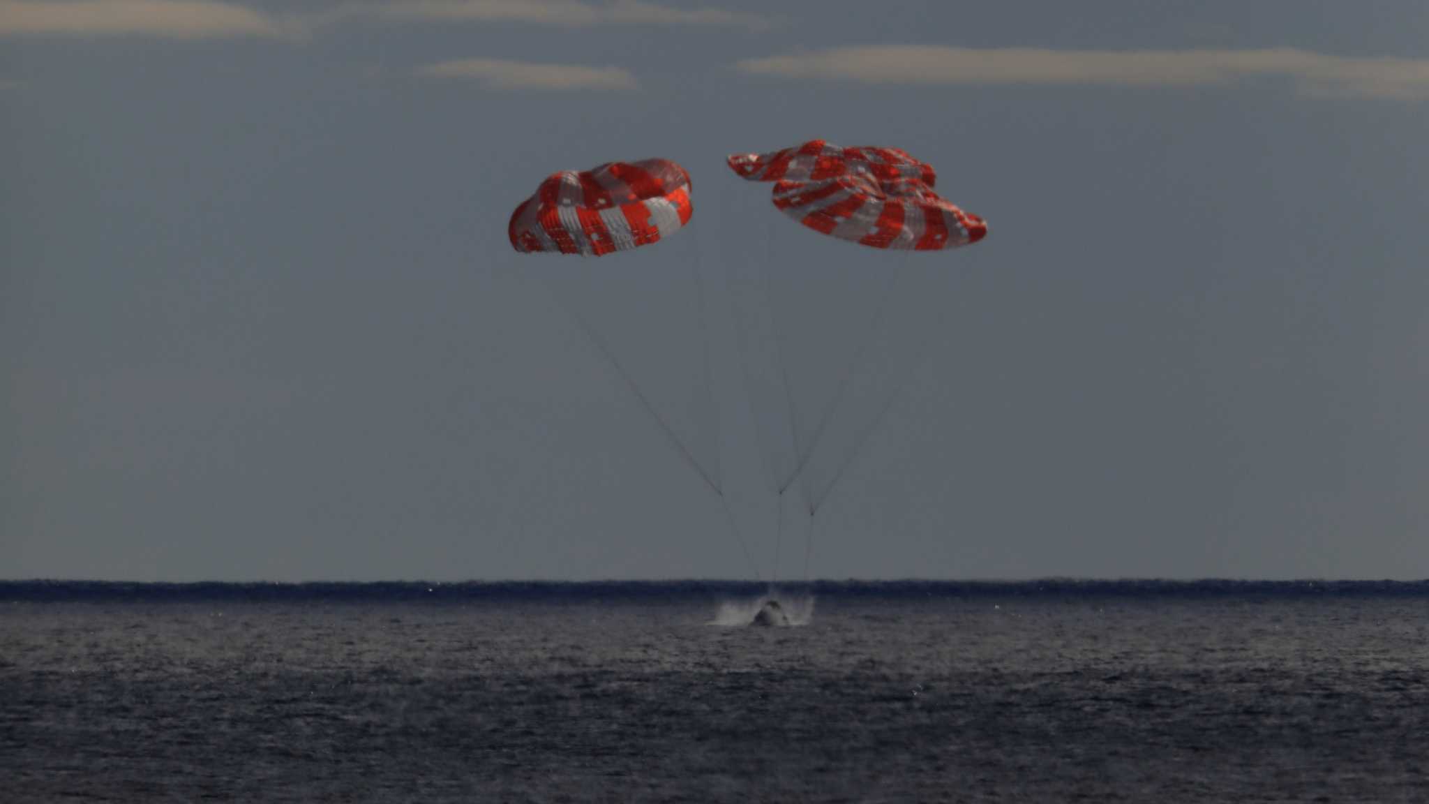 NASA Orion capsule safely blazes back from moon, aces test