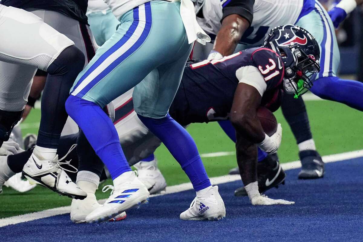 Houston Texans running back Dameon Pierce (31) crawls into the end zone for a 1-yard touchdown run during the first half of an NFL football game Sunday, Dec. 11, 2022, in Arlington.