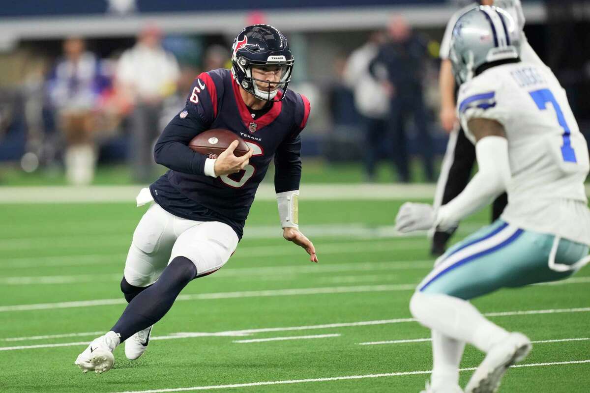 Houston Texans quarterback Jeff Driskel (6) runs around the end defended by Dallas Cowboys cornerback Trevon Diggs (7) during the first half of an NFL football game Sunday, Dec. 11, 2022, in Arlington.