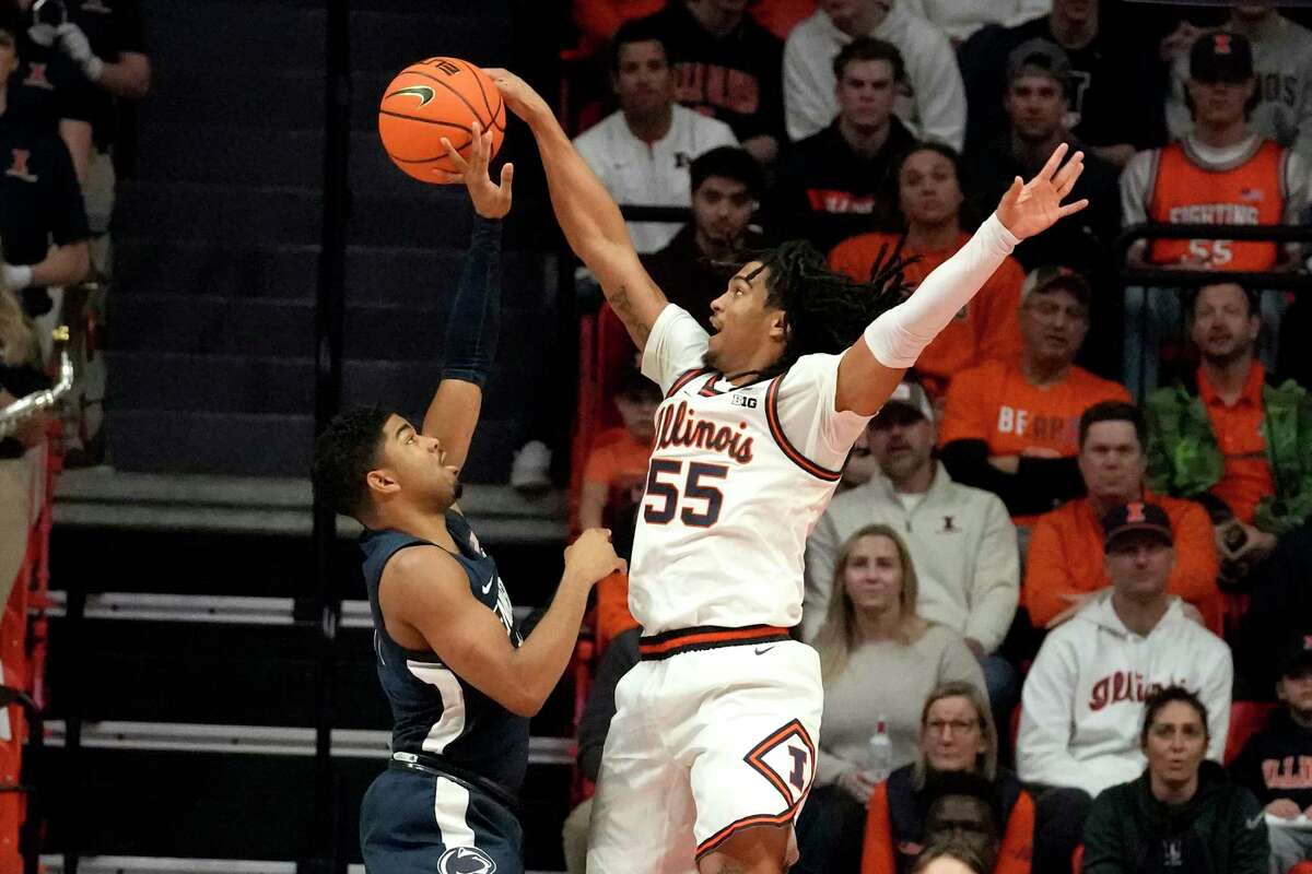 Freshman Skyy Clark of Illinois (55) blocks a shot by Penn State's Camren Wynter in a Dec. 10 game in Champaign. Clark has announced that he is stepping away from the team.  