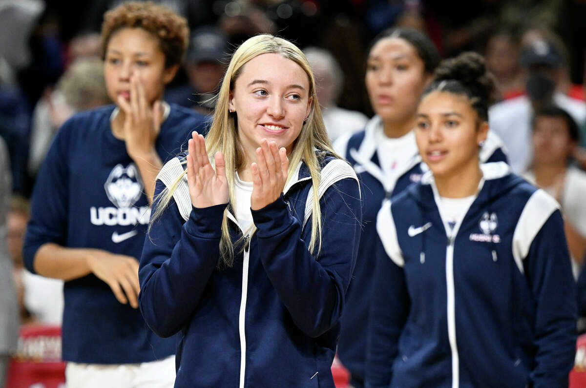 COLLEGE PARK, MARYLAND - DECEMBER 11: Paige Bueckers #5 of the UConn Huskies watches player introductions before the game against the Maryland Terrapins at Xfinity Center on December 11, 2022 in College Park, Maryland. (Photo by Greg Fiume/Getty Images)
