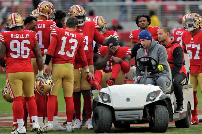 San Francisco quarterback John Brodie is sacked and dropped for a