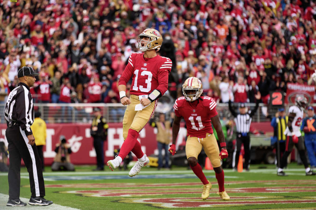 Brock Purdy of the San Francisco 49ers celebrates after rushing for a touchdown against the Tampa Bay Buccaneers during the first half at Levi's Stadium on December 11, 2022.