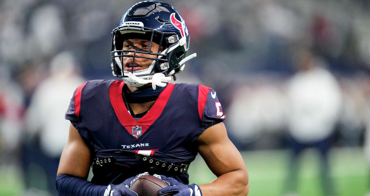 Houston Texans safety Jalen Pitre (5) jogs across the field after making a catch before an NFL football game against the Dallas Cowboys on Sunday, Dec. 11, 2022, in Arlington.